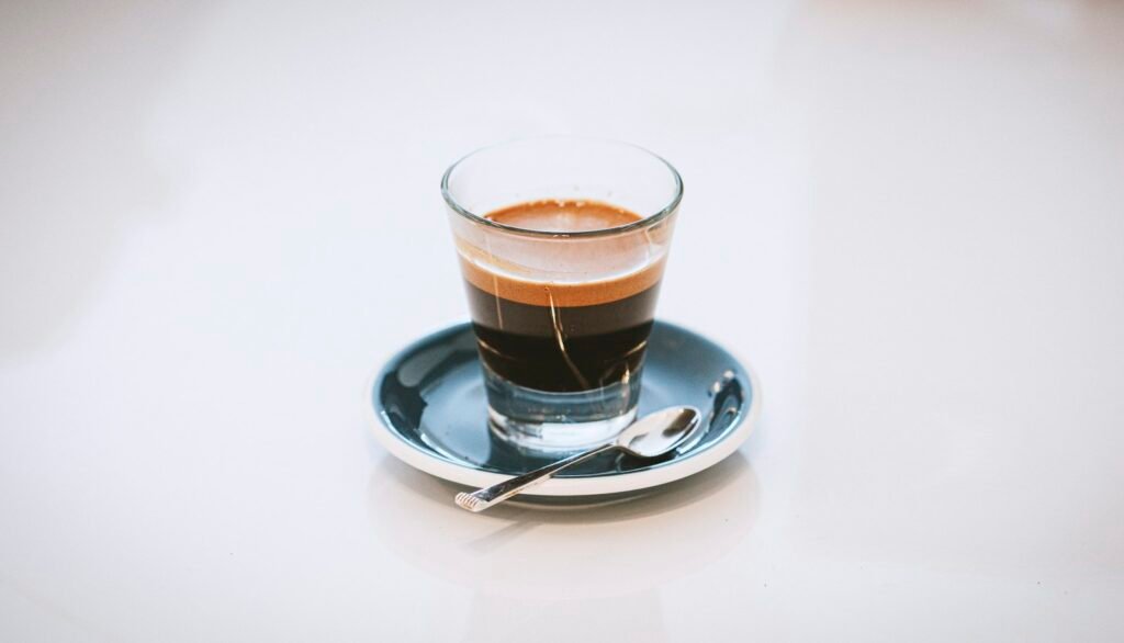 Espresso shot in a glass on a saucer: why does espresso taste bitter, and how to fix it